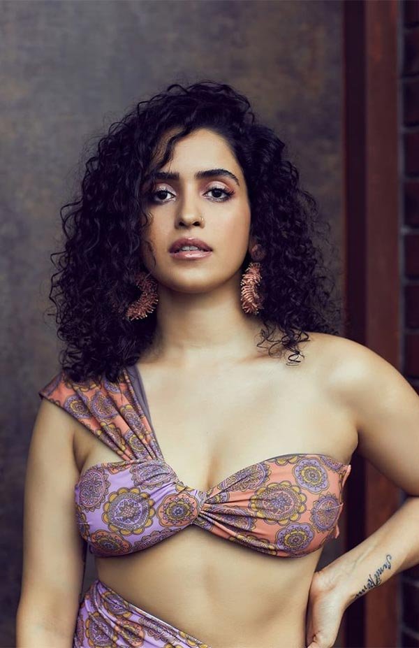 Sanya Malhotra bikini top high slit skirt legs